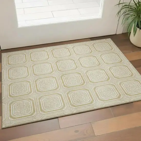 Gold And Ivory Geometric Washable Area Rug With UV Protection Photo 1