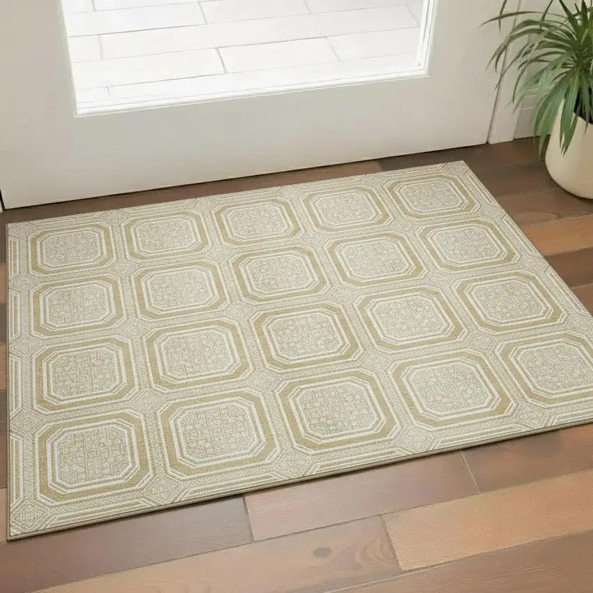 Gold And Ivory Geometric Washable Area Rug With UV Protection Photo 1