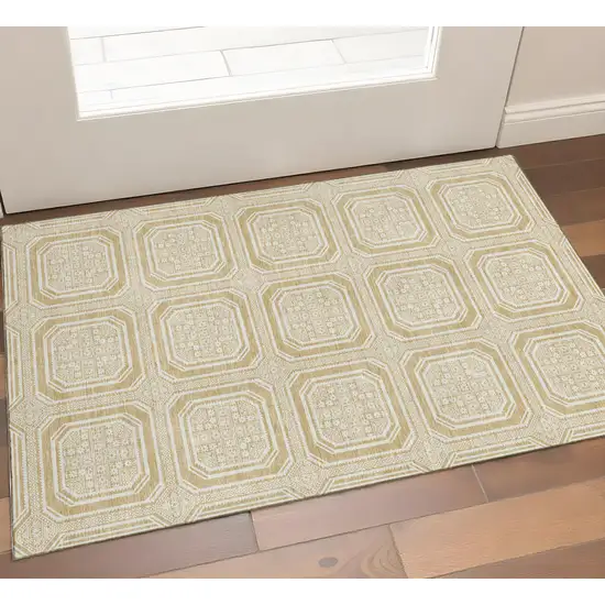 Gold And Ivory Geometric Washable Area Rug With UV Protection Photo 1