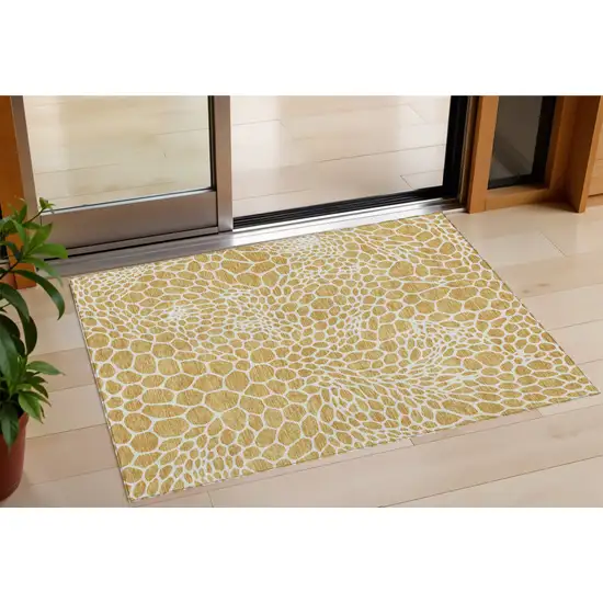 Gold And Ivory Geometric Washable Indoor Outdoor Area Rug Photo 1
