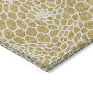 Photo of Gold And Ivory Geometric Washable Indoor Outdoor Area Rug