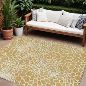 Photo of Gold And Ivory Geometric Washable Indoor Outdoor Area Rug