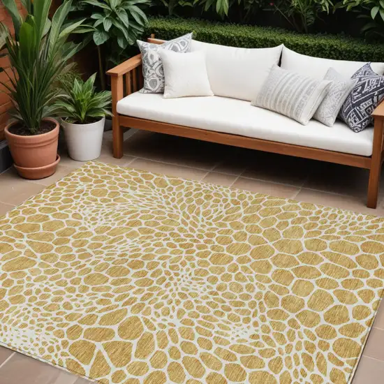 Gold And Ivory Geometric Washable Indoor Outdoor Area Rug Photo 1