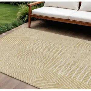 Photo of Gold And Ivory Geometric Washable Indoor Outdoor Area Rug