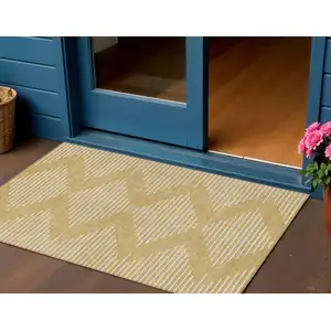 Photo of Gold And Ivory Geometric Washable Indoor Outdoor Area Rug