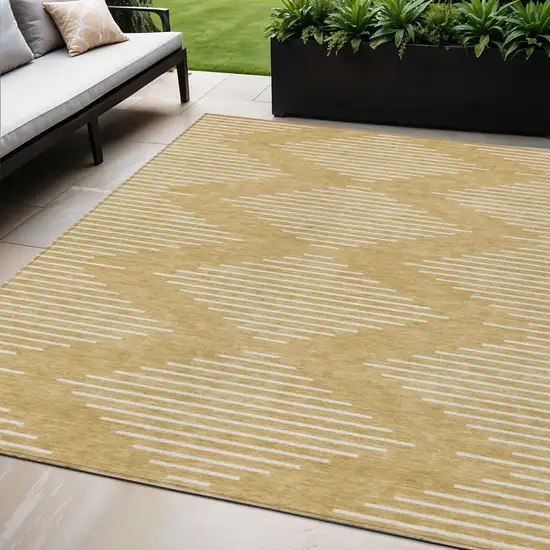 Gold And Ivory Geometric Washable Indoor Outdoor Area Rug Photo 1