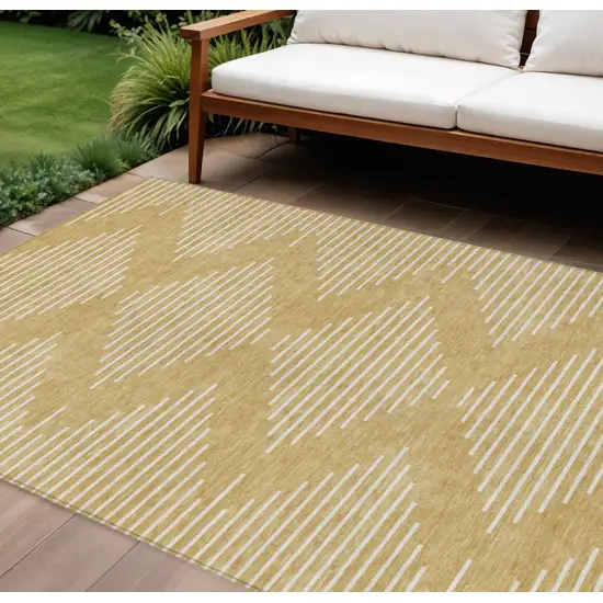 Gold And Ivory Geometric Washable Indoor Outdoor Area Rug Photo 1