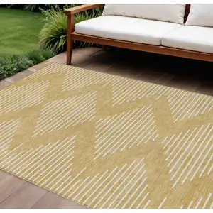 Photo of Gold And Ivory Geometric Washable Indoor Outdoor Area Rug