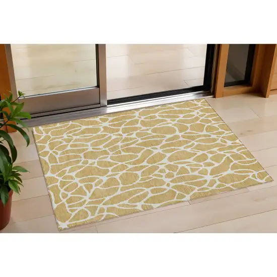 Gold And Ivory Geometric Washable Indoor Outdoor Area Rug Photo 1