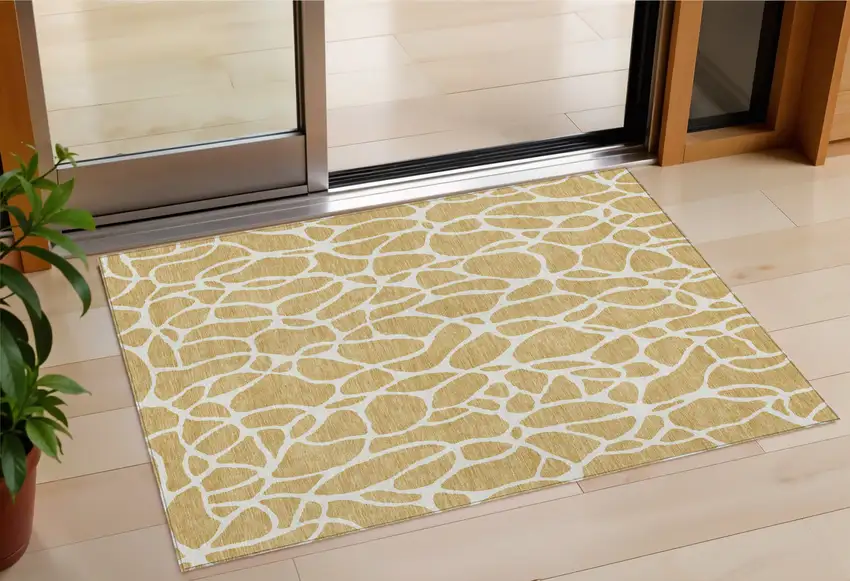 Gold And Ivory Geometric Washable Indoor Outdoor Area Rug Photo 1