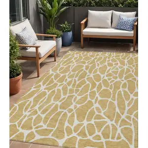Photo of Gold And Ivory Geometric Washable Indoor Outdoor Area Rug