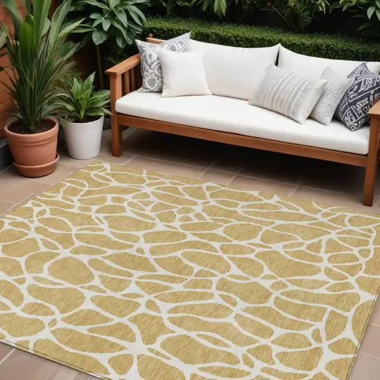 Gold And Ivory Geometric Washable Indoor Outdoor Area Rug Photo 1