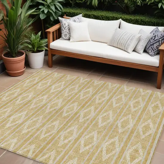 Gold And Ivory Geometric Washable Indoor Outdoor Area Rug Photo 1