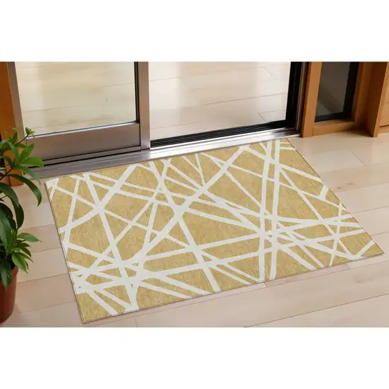 Gold And Ivory Geometric Washable Indoor Outdoor Area Rug Photo 1