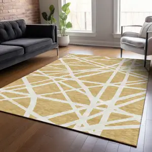 Photo of Gold And Ivory Geometric Washable Indoor Outdoor Area Rug