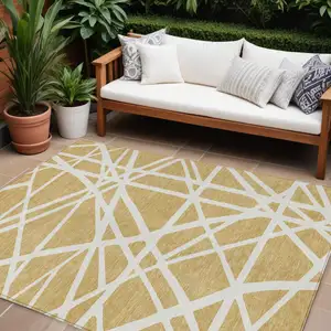 Photo of Gold And Ivory Geometric Washable Indoor Outdoor Area Rug