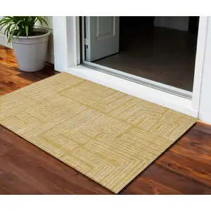 Photo of Gold And Ivory Geometric Washable Indoor Outdoor Area Rug