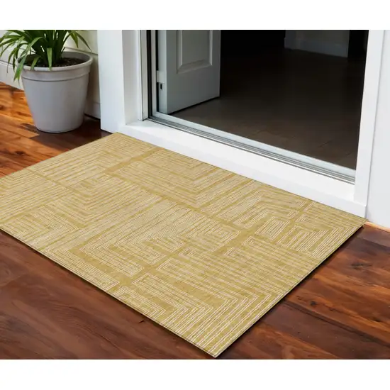 Gold And Ivory Geometric Washable Indoor Outdoor Area Rug Photo 1