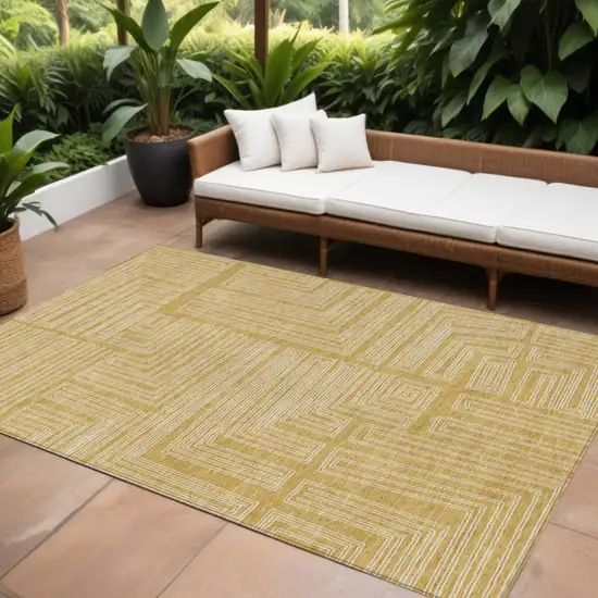 Gold And Ivory Geometric Washable Indoor Outdoor Area Rug Photo 1