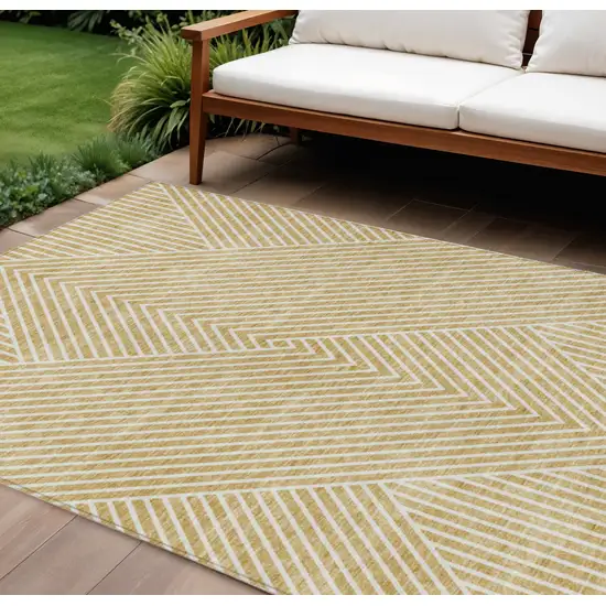 Gold And Ivory Geometric Washable Indoor Outdoor Area Rug Photo 1