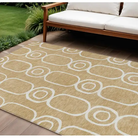 Gold And Ivory Geometric Washable Indoor Outdoor Area Rug Photo 1