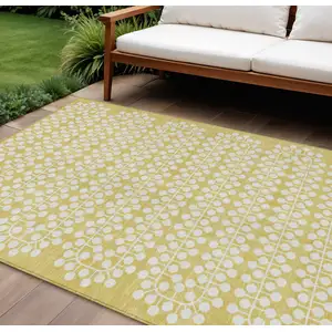 Photo of Gold And Ivory Geometric Washable Indoor Outdoor Area Rug