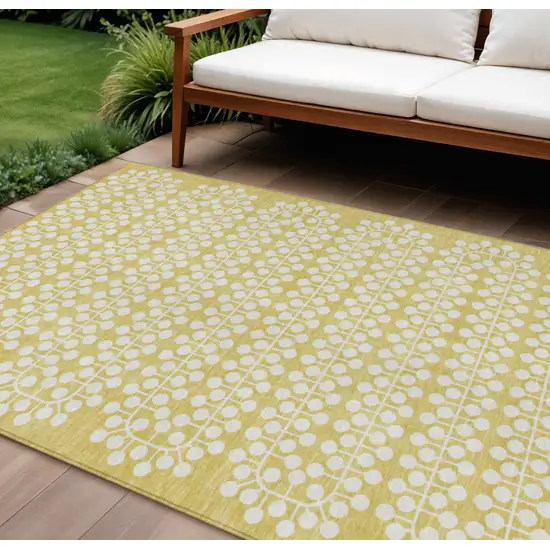 Gold And Ivory Geometric Washable Indoor Outdoor Area Rug Photo 1