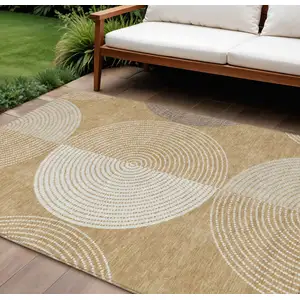 Photo of Gold And Ivory Geometric Washable Indoor Outdoor Area Rug