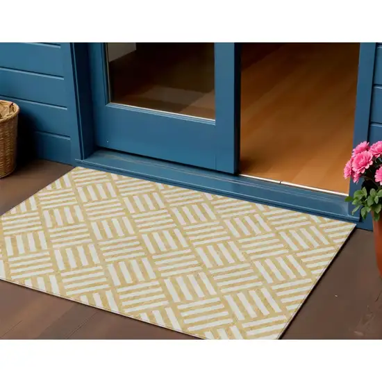 Gold And Ivory Geometric Washable Indoor Outdoor Area Rug Photo 1