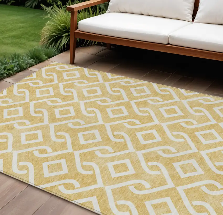 Gold And Ivory Geometric Washable Indoor Outdoor Area Rug Photo 1
