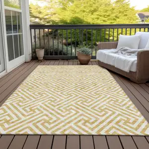 Photo of Gold And Ivory Geometric Washable Indoor Outdoor Area Rug