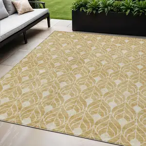 Photo of Gold And Ivory Geometric Washable Indoor Outdoor Area Rug