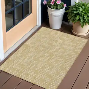 Photo of Gold And Ivory Geometric Washable Indoor Outdoor Area Rug