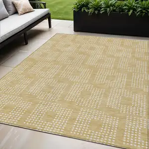 Photo of Gold And Ivory Geometric Washable Indoor Outdoor Area Rug