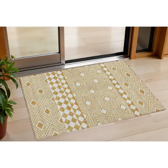 Gold And Ivory Geometric Washable Indoor Outdoor Area Rug Photo 1