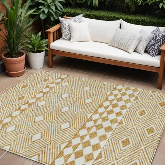 Gold And Ivory Geometric Washable Indoor Outdoor Area Rug Photo 1