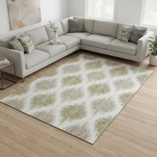 Gold And Ivory Ikat Washable Area Rug With UV Protection Photo 2