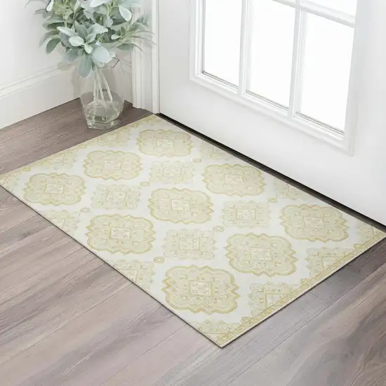 Gold And Ivory Medallion Washable Area Rug With UV Protection Photo 1