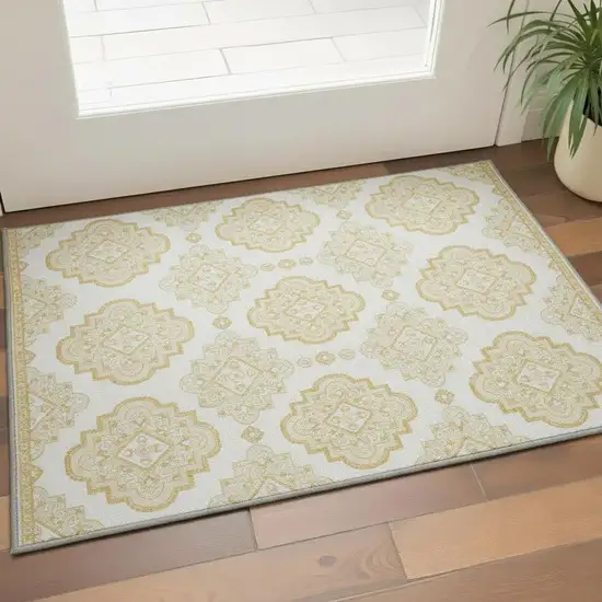 Gold And Ivory Medallion Washable Area Rug With UV Protection Photo 2