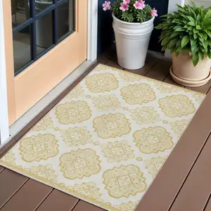 Photo of Gold And Ivory Medallion Washable Indoor Outdoor Area Rug