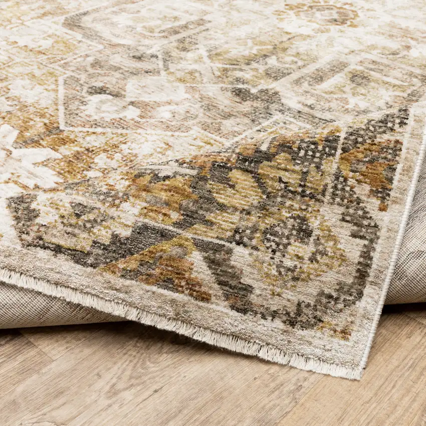 Gold And Ivory Oriental Power Loom Stain Resistant Area Rug With Fringe Photo 9