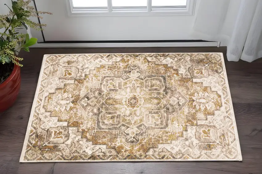 Gold And Ivory Oriental Power Loom Stain Resistant Area Rug With Fringe Photo 1