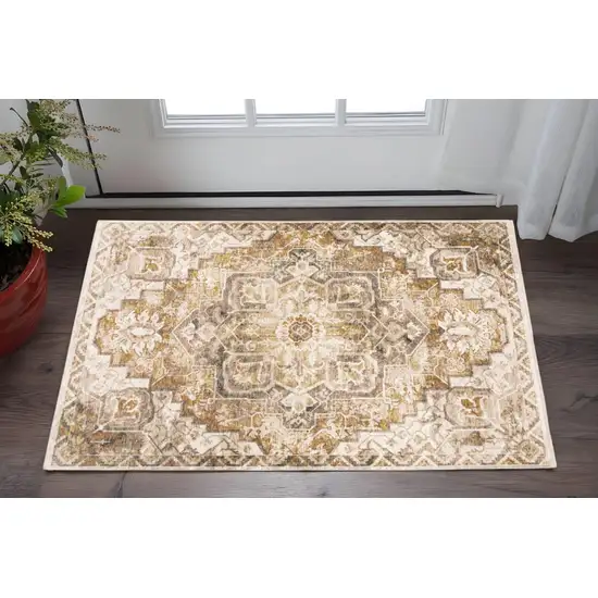 Gold And Ivory Oriental Power Loom Stain Resistant Area Rug With Fringe Photo 1