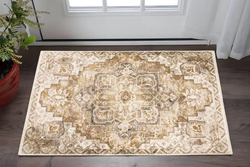 Gold And Ivory Oriental Power Loom Stain Resistant Area Rug With Fringe Photo 1
