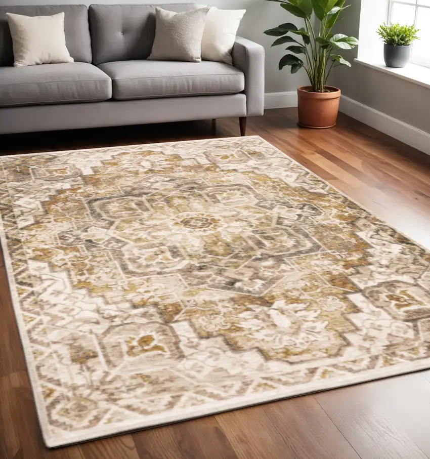 Gold And Ivory Oriental Power Loom Stain Resistant Area Rug With Fringe Photo 1