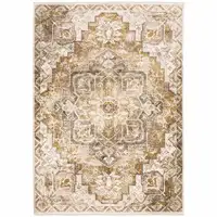 Photo of Gold And Ivory Oriental Power Loom Stain Resistant Area Rug With Fringe