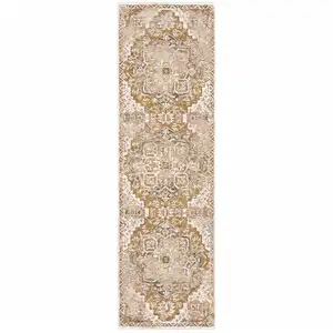 Photo of Gold And Ivory Oriental Power Loom Stain Resistant Runner Rug With Fringe