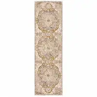 Photo of Gold And Ivory Oriental Power Loom Stain Resistant Runner Rug With Fringe