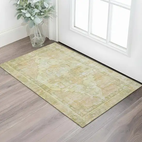 Gold And Ivory Oriental Washable Area Rug With UV Protection Photo 2