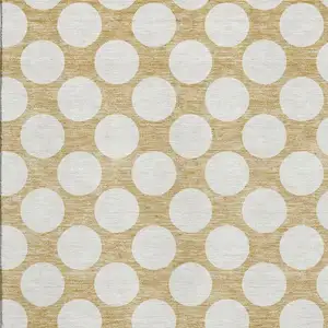 Photo of Gold And Ivory Polka Dot Washable Area Rug With UV Protection